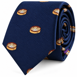 Introducing the Dumplings Skinny Tie: a rolled-up navy blue skinny tie featuring a repeating pattern of small embroidered baskets filled with dumplings—an ideal foodie gift for culinary enthusiasts.