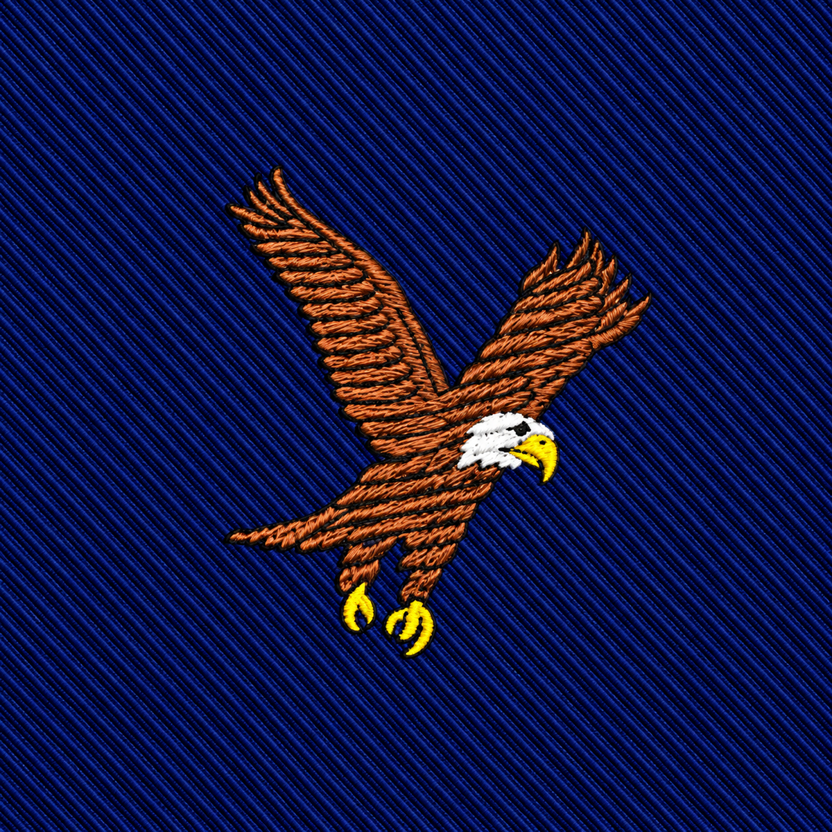 Add a bold touch to your collection with the Eagle Bird Skinny Tie, featuring an embroidered eagle with outstretched wings, a white head, and yellow beak and talons on a diagonal navy blue textured background.