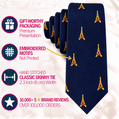 Eiffel Tower Skinny Tie in dark blue featuring small embroidered Eiffel Tower motifs, accompanied by text highlighting product features and the brand’s reputation for Parisian charm.