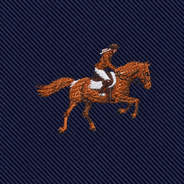 Introducing the Equestrian Skinny Tie—a sophisticated accessory crafted from dark blue, diagonally ribbed fabric and adorned with elegant embroidery depicting a person riding a horse. The figure and horse are expertly stitched in rich brown and white threads, making this tie perfect for equestrian enthusiasts and those who admire refined style inspired by classic horse racing events.