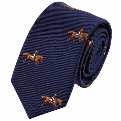 The Equestrian Skinny Tie is shown rolled up against a white background, featuring a navy blue color with a repeating pattern of embroidered brown horses and riders.
