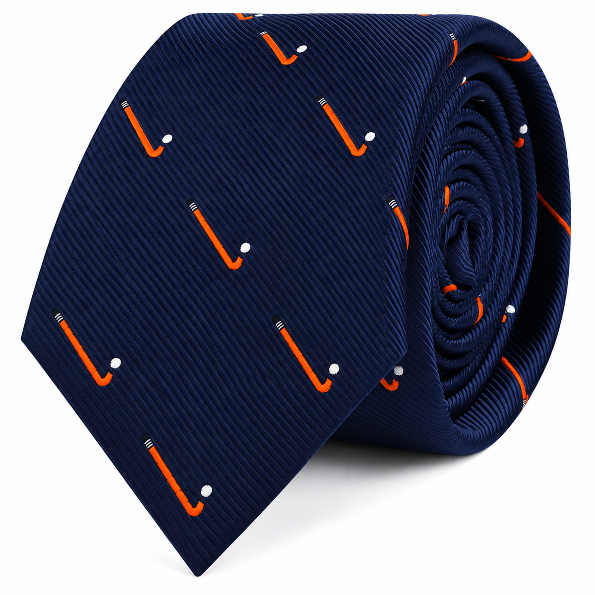 A coiled navy blue Field Hockey Skinny Tie featuring a repeating pattern of orange sticks and white balls.