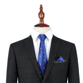 A black suit with a white dress shirt and the Pink Flamingo Navy Skinny Tie & Pocket Square Set displayed on a dress form.