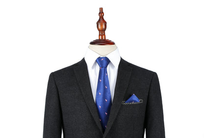 A black suit with a white dress shirt and the Pink Flamingo Navy Skinny Tie & Pocket Square Set displayed on a dress form.