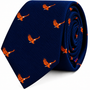 A dark blue Flying Eagle Skinny Tie featuring a repeating pattern of orange flying eagles.