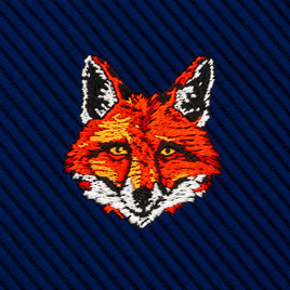 An embroidered fox head patch on a dark blue ribbed Fox Head Skinny Tie.