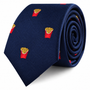 A navy blue Fries Skinny Tie featuring a repeated pattern of embroidered french fry cartons.