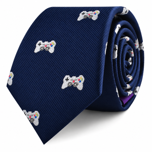 A coiled navy blue Game Controller Skinny Tie featuring a repeating pattern of white video game controllers.