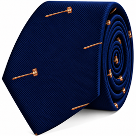 Gavel Skinny Tie in dark blue featuring a repeating pattern of small gold-tone gavels.