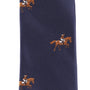 Close-up of the Giddy Up Horse Racing Skinny Tie, a navy blue tie with an embroidered repeating pattern of horses and jockeys in brown, white, and black—perfect for derby day accessories.