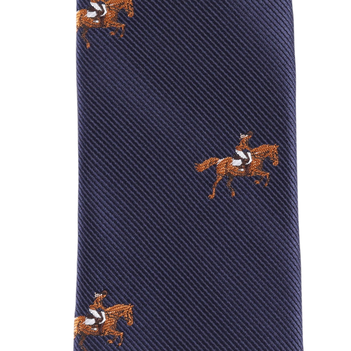 Close-up of the Giddy Up Horse Racing Skinny Tie, a navy blue tie with an embroidered repeating pattern of horses and jockeys in brown, white, and black—perfect for derby day accessories.