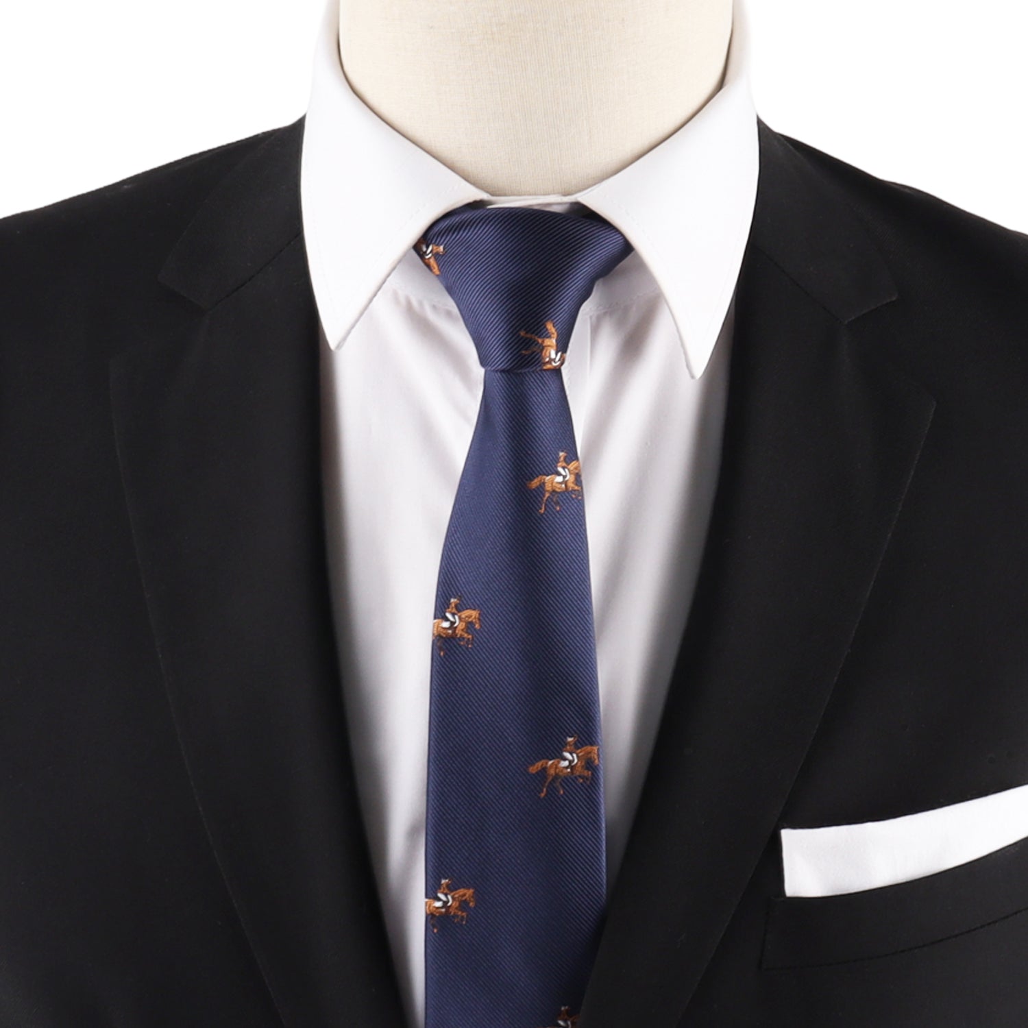 A mannequin wears a black suit, white shirt, Giddy Up Horse Racing Skinny Tie in navy featuring small horse rider patterns, and a white pocket square—perfect for adding standout derby day style.