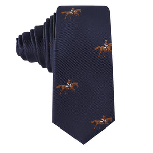 The Equestrian Skinny Tie in navy blue features an embroidered pattern of brown and white horse riders—an ideal accessory for the Melbourne Cup.