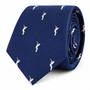 Golf Swing Skinny Tie in blue, showcasing a repeating pattern of small white golfer silhouettes mid-swing, presented rolled up on a white background—a perfect golf gift for any enthusiast.