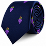 A navy blue Grapes Skinny Tie featuring a repeating pattern of embroidered purple grapes.