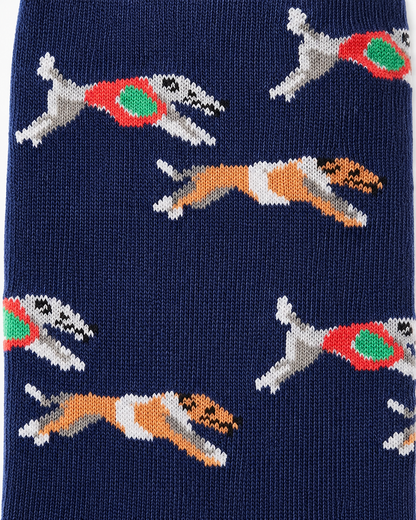 Blue fabric featuring knit dogs in mid-leap with red and green jackets—Greyhound Racing Socks perfect for any breed lover.