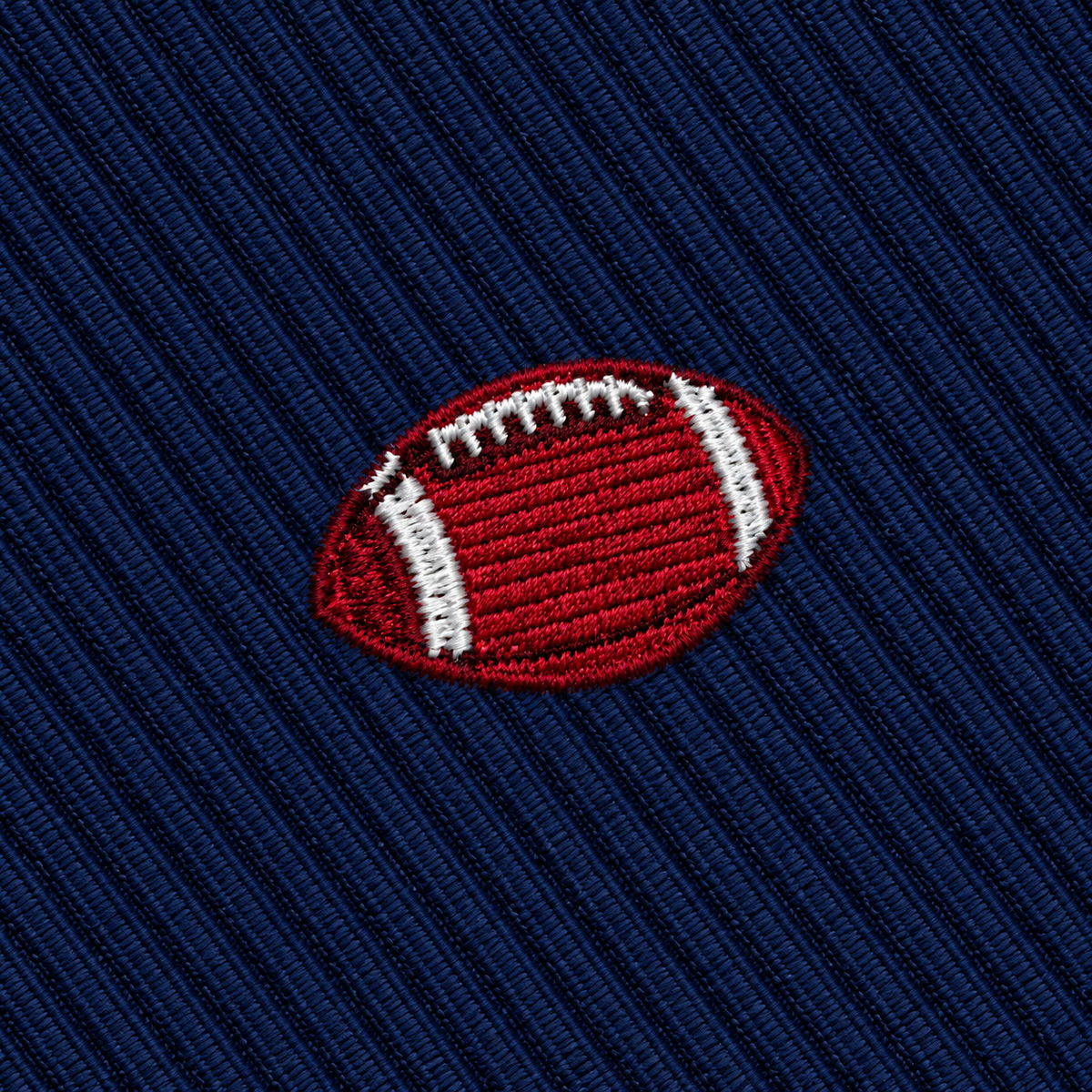 Gridiron Skinny Tie featuring an embroidered football on a dark blue ribbed sports necktie.