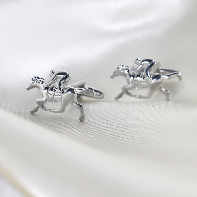 Horse Racing Cufflinks, shaped like jockeys riding horses and set against a light fabric background, capture sartorial greatness in every detail.