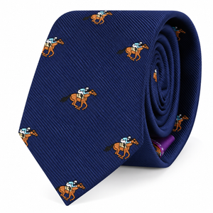 Introducing the Horse Racing Skinny Tie in classic navy blue, showcasing a repeating embroidered pattern of jockeys riding brown horses. Seen here rolled up, this novelty tie is an ideal accessory for horse racing enthusiasts or anyone looking to express their unique equestrian style.