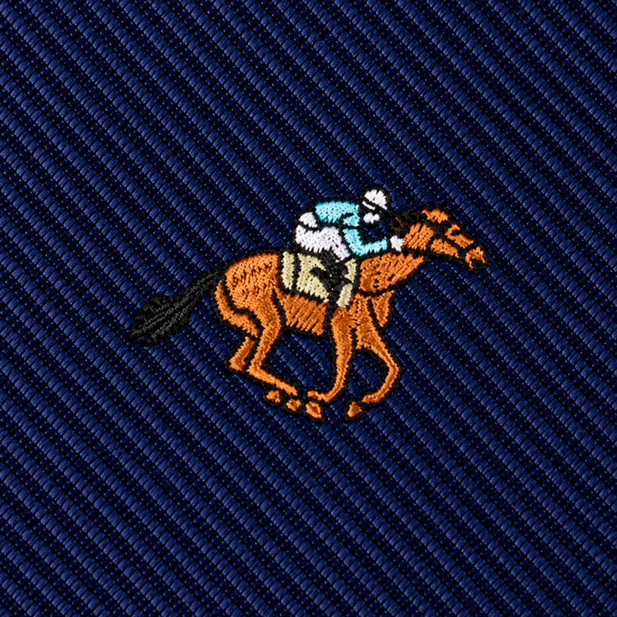 Dark blue Horse Racing Skinny Tie featuring an embroidered jockey riding a brown horse.