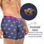 A man wears Horse Racing Underwear with a blue jockey print and horse rider motif; close-up reveals tiny fabric perforations for breathability. Text emphasizes the underwear's breathable fabric and comfortable inner lining.