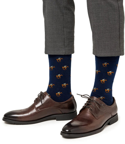 A person wearing gray plaid dress pants, Horse Racing Socks featuring a navy blue horse pattern, and brown leather dress shoes.