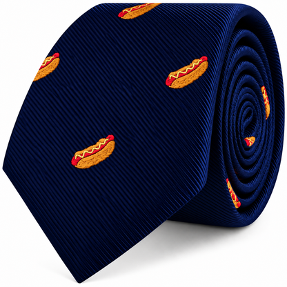 A coiled navy blue Hotdog Skinny Tie featuring an embroidered novelty pattern.