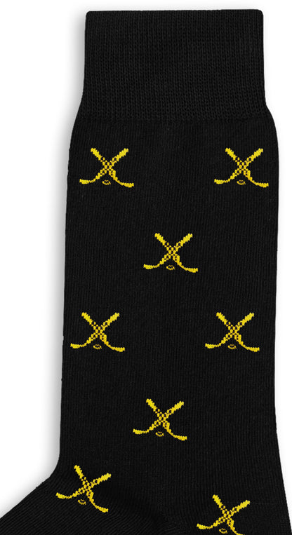 The Yellow and Navy Ice Hockey Cross Socks feature a black base with repeating small yellow crossed sabers, offering moisture-wicking comfort to keep your feet dry all day.