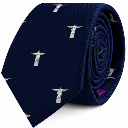Jesus Christ The Redeemer skinny tie in dark blue, featuring a repeated white pattern of the statue as a faith-inspired accessory.