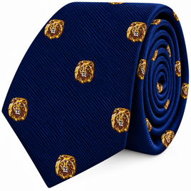 A rolled navy blue King Lion Skinny Tie featuring a repeating pattern of gold lion head portraits.