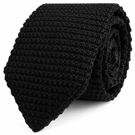 The Black Knitted Skinny Tie is displayed rolled up against a white background.