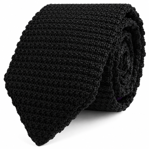 The Black Knitted Skinny Tie is displayed rolled up against a white background.
