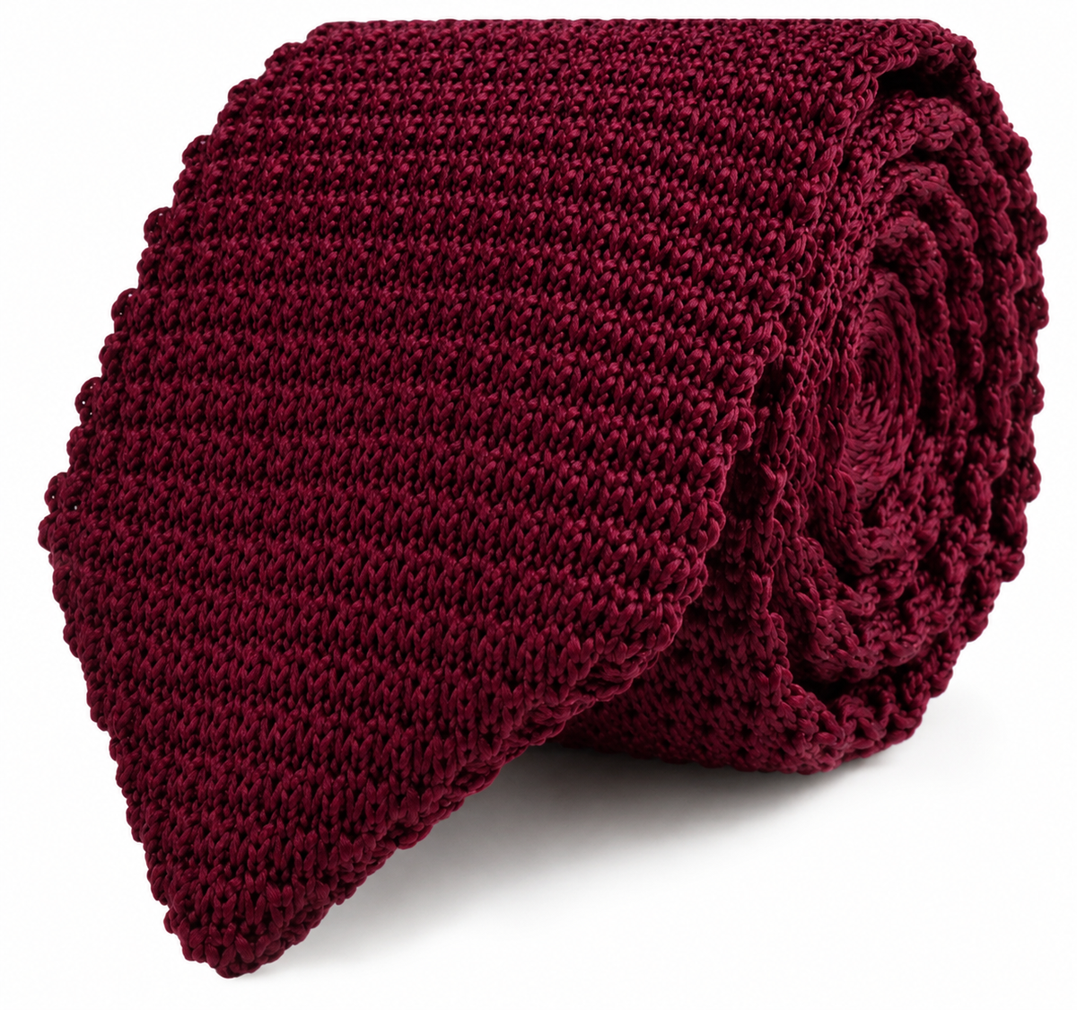 The Maroon Knitted Skinny Tie features a rolled-up design with a textured pattern and a straight, flat edge, making it the perfect stylish accessory for men.