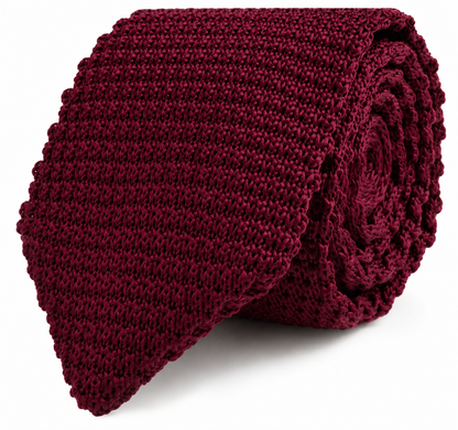 The Maroon Knitted Skinny Tie features a rolled-up design with a textured pattern and a straight, flat edge, making it the perfect stylish accessory for men.