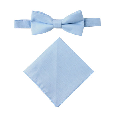 The Light Blue Cotton Bow Tie & Pocket Square Set is showcased against a white background, providing a refreshing touch perfect for spring.