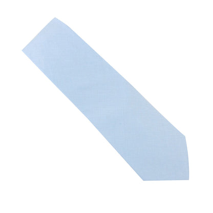 The Light Blue Cotton Skinny Tie & Pocket Square Set embodies the elegance of timeless style, reminiscent of azure skies against a pristine white backdrop.
