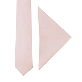 A Light Pink Cotton Business Tie & Pocket Square Set is on the left, and a folded light pink pocket square is on the right against a white background, creating an ensemble that exudes timeless sophistication.