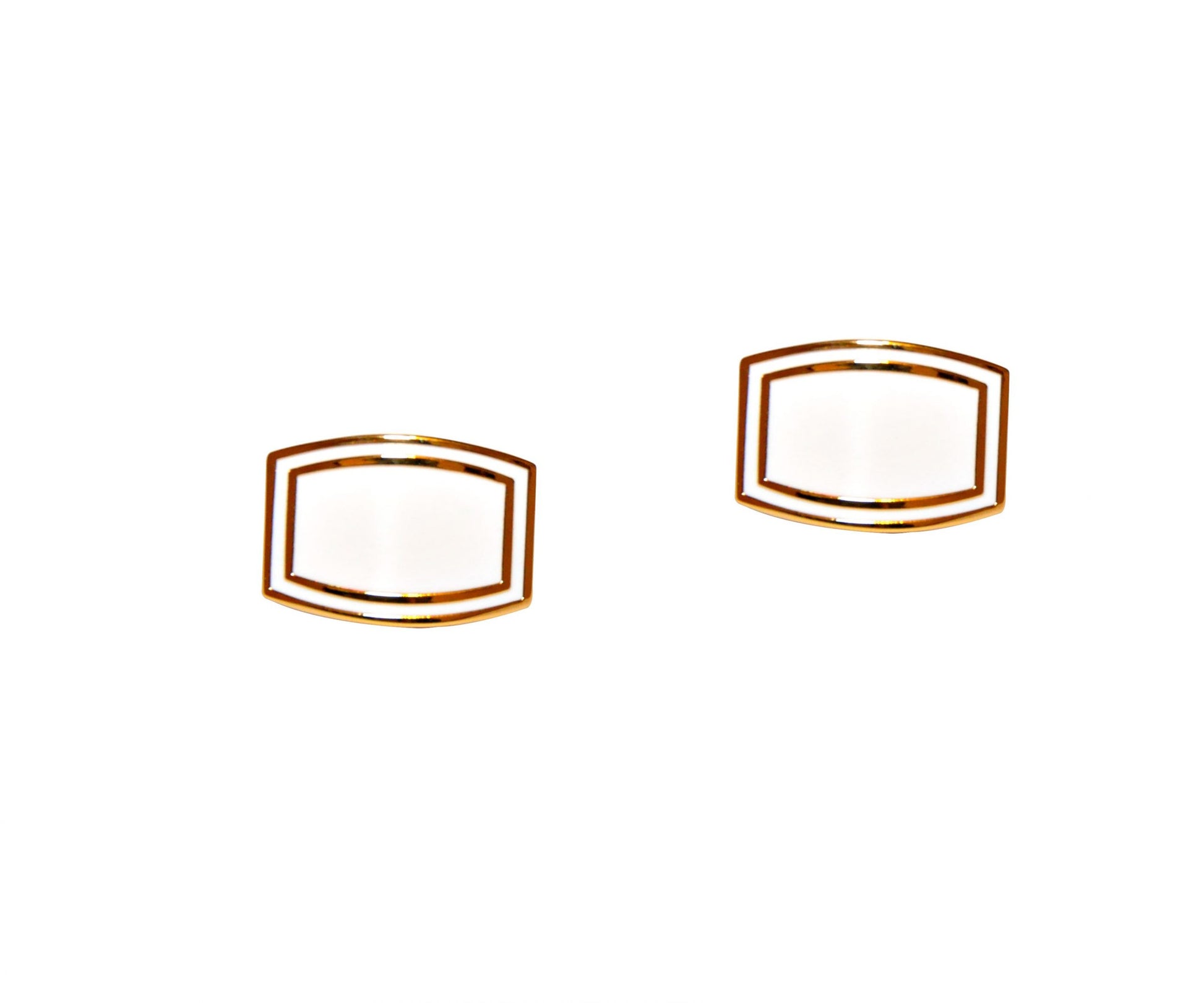 A pair of White Gold Cufflinks, featuring rectangular designs with white enamel centers, showcased against a plain white background, exuding pristine elegance.