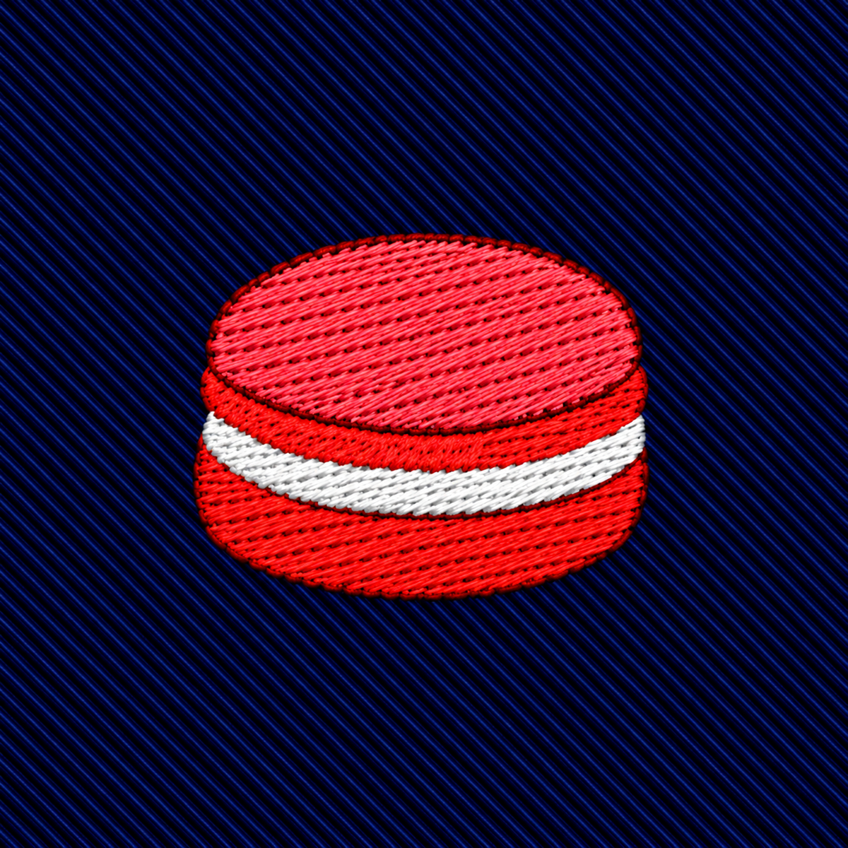 Macaron Skinny Tie featuring an embroidered red and white macaron icon for dessert lovers on a dark blue ribbed background.