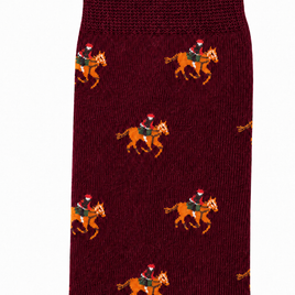 Close-up of Maroon Thoroughbred Horse Racing Socks, featuring a repeating pattern of a rider in a Santa hat on horseback.