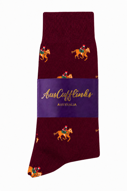 Maroon Thoroughbred Horse Racing Socks with a festive Santa Claus riding a horse, wrapped in a purple "AusCufflinks Australia" label.