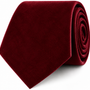 A rolled-up Maroon Velvet Skinny Tie is displayed against a white background.