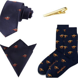 The Melbourne Race Horse Bundle includes a navy tie, pocket square, and socks with orange horse motifs plus a gold tie clip—perfect for any horse racing gift occasion. Displayed on a white background, it’s ideal for enthusiasts.