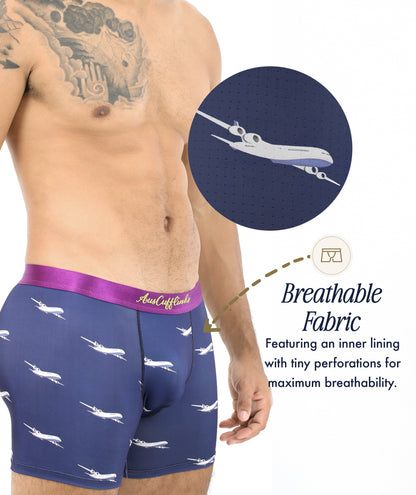 A man wears Airplane Underwear—navy boxers with a purple waistband and white airplane print; inset shows perforated, breathable fabric. Perfect for pilots, these unique boxers make ideal gifts for aviation enthusiasts.
