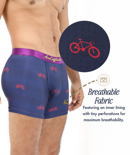 A person wears Cyclist Underwear in navy with red bicycle prints; inset reveals perforated, moisture-wicking fabric. Text highlights its breathable design, making Cyclist Underwear perfect for cycling enthusiasts.