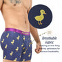 A man models blue Duck Underwear featuring a playful yellow duck print; an inset reveals tiny fabric perforations for breathability. Fun and quirky, Duck Underwear offers ventilated comfort—making it a delightful, comfortable gift.