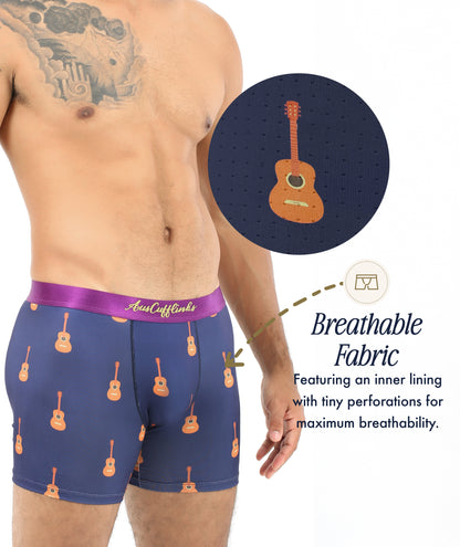 A man wears Guitar Underwear in navy blue with a musical print; a close-up shows tiny perforations and a moisture-wicking, breathable inner lining—ideal for music lovers wanting all-day comfort.