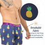 Man wearing Pineapple Underwear—blue boxer briefs with a pineapple pattern and close-up of tiny perforations. Text highlights moisture-wicking, breathable fabric and inner lining, making these the perfect tropical underwear.