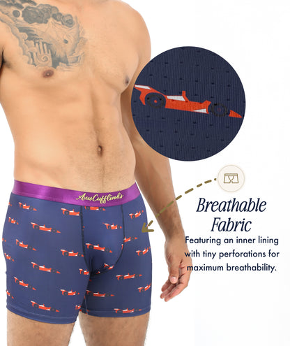 A person models Racing Car Underwear in navy blue with a red car print; a circular inset reveals the perforated, breathable lining. Highlighted text notes these moisture-wicking boxers are ideal for motorsport enthusiasts.