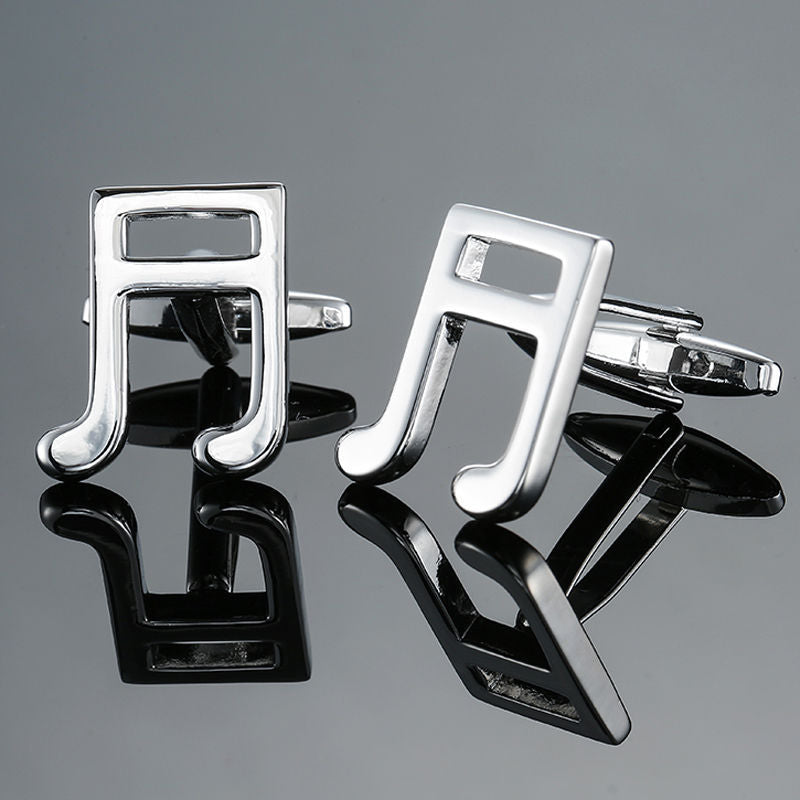 Music Note Cufflinks shaped like silver notes, displayed on a reflective surface—perfect men's music accessories and an ideal gift for musicians.